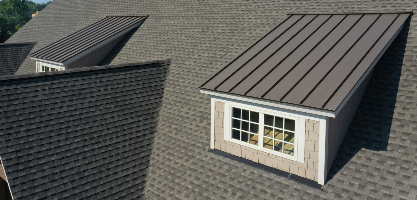 A home roof with shingles and metal