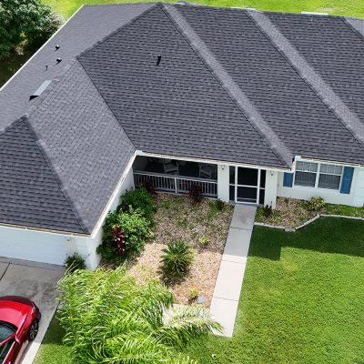 drone shot of a single family residential home with a gray shingle roof